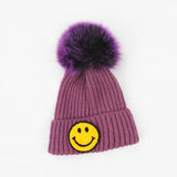 Smiley beanie hat fur pompom