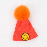 Smiley beanie hat fur pompom